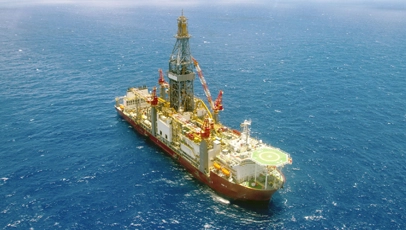 Daytime photography of an oil platform at sea.